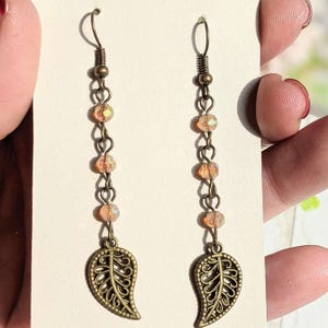 Antique Bronze Filigree Leaf dangle earrings - - LadybugfeetDesigns -