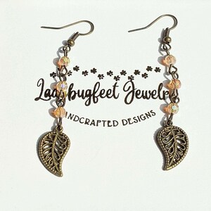 Antique Bronze Filigree Leaf dangle earrings - - LadybugfeetDesigns -