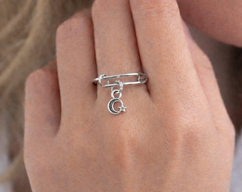 Anillo con dije expandible de estrella lunar