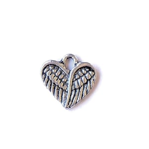 Tiny Silver Winged Heart Charm - - LadybugfeetDesigns -