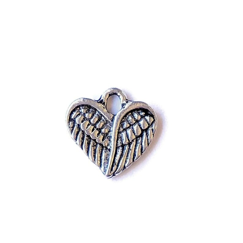Tiny Silver Winged Heart Charm - - LadybugfeetDesigns -