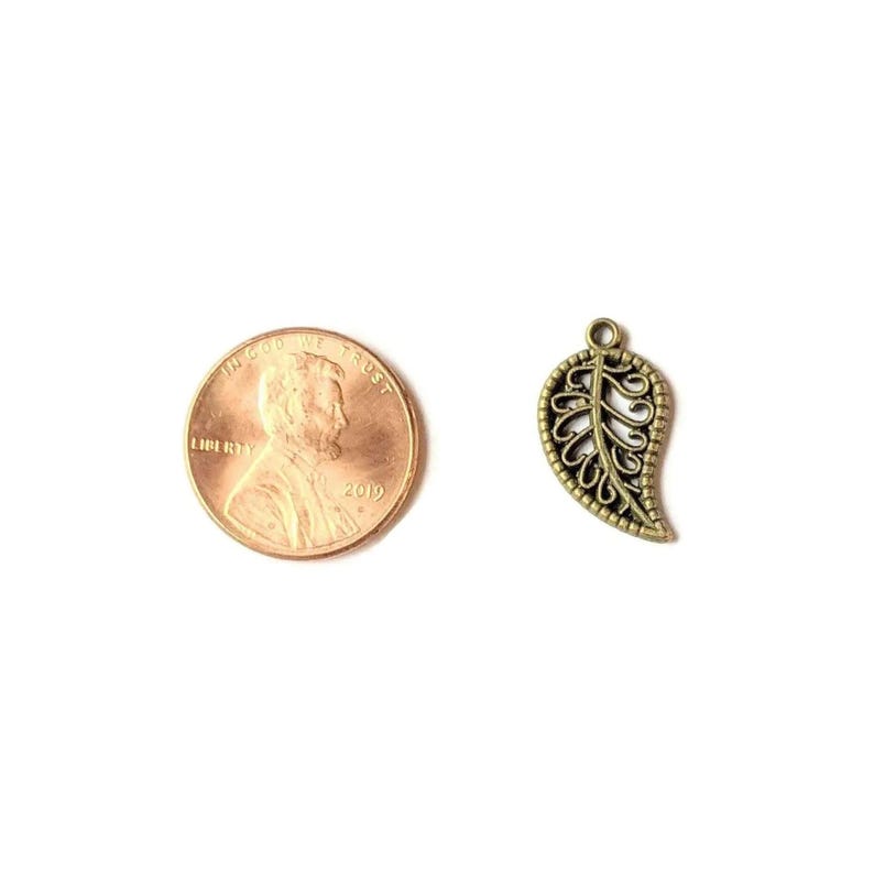 Antique Bronze Filigree Leaf Charm - - LadybugfeetDesigns -