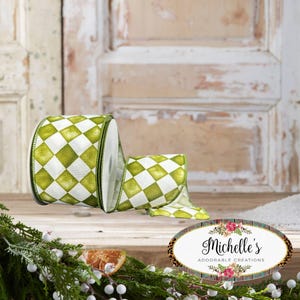 May include: A roll of wired ribbon featuring a repeating green and white diamond pattern. The ribbon has a textured fabric finish and dark green stitched edges. An oval logo sticker with the text Michelle's ADORABLE CREATIONS is visible.