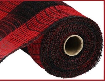 May include: A roll of red and black buffalo plaid mesh ribbon. The mesh is tightly woven, creating a textured surface. The roll is partially unraveled, revealing the cardboard core. This ribbon is suitable for crafting and decorating.