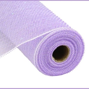 May include: A roll of lavender-colored deco mesh. The mesh has a woven pattern with a slight shimmer. The roll is tightly wound, revealing a cardboard core. The edges of the mesh are finished with a white border.