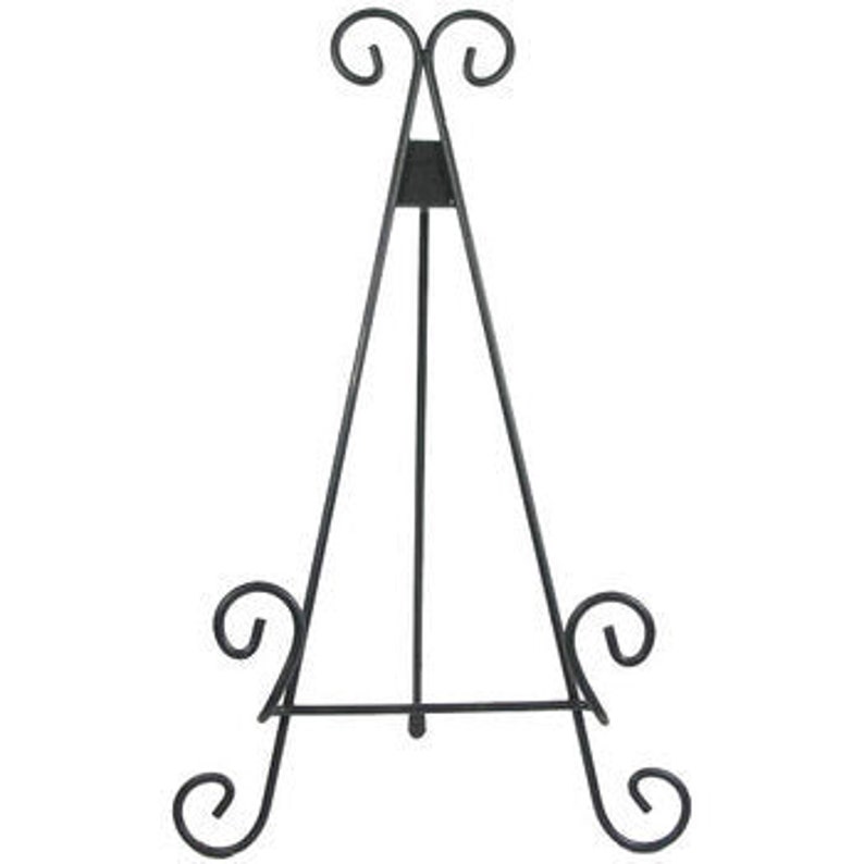 May include: Black metal easel stand with a decorative scroll design. The easel is designed to hold artwork, photos, or other items.