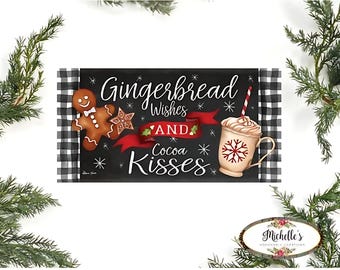 May include: A rectangular sign with the words "Gingerbread Wishes and Cocoa Kisses" in white script on a black background. The sign features a gingerbread man, a star, and a mug of cocoa. The sign is framed with a black and white checkered pattern.