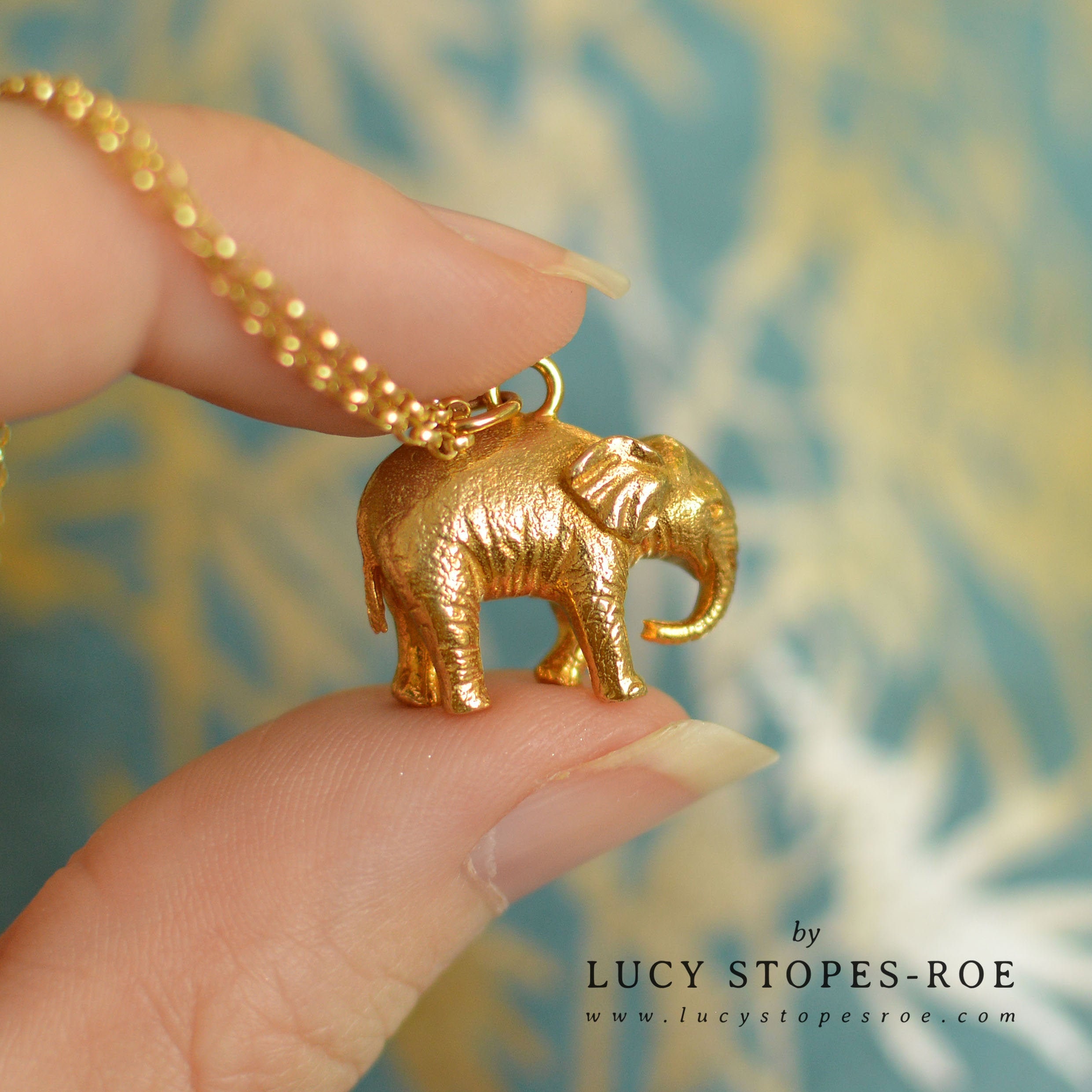 White antique gold tone elephant pendant necklace earrings set at ₹2950 |  Azilaa