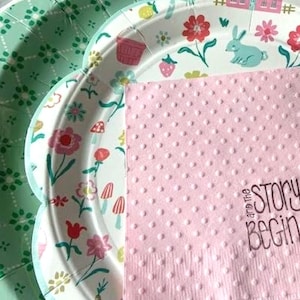 Hand stamped and embossed cocktail napkins with and the story begins.  Paired with springtime cottage and green whimsical plates for your event.