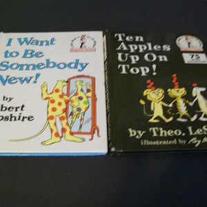 May include: Two children's books, one titled "I Want to Be Somebody New!" by Robert Lopshire and the other titled "Ten Apples Up On Top!" by Theo. LeSieg, illustrated by Roy McKie.