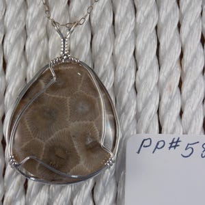PP#584 Petoskey stone  wire wrapped with solid sterling silver.
