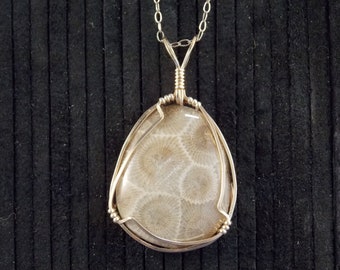 PP#543   Petoskey stone wire wrapped with 14k gold plated wire.