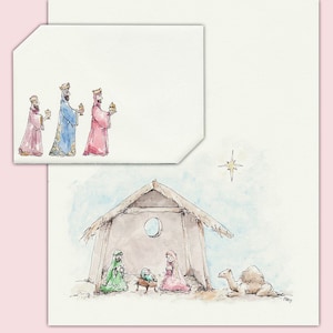 Pode incluir: Ilustração em aquarela de uma cena de Natal com os três reis magos e uma estrela. A imagem principal mostra um estábulo com Maria, José e o menino Jesus. Um camelo descansa perto.