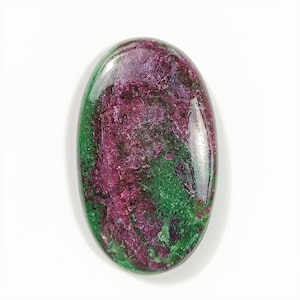 May include: A green and pink oval cabochon gemstone with a smooth, polished surface.