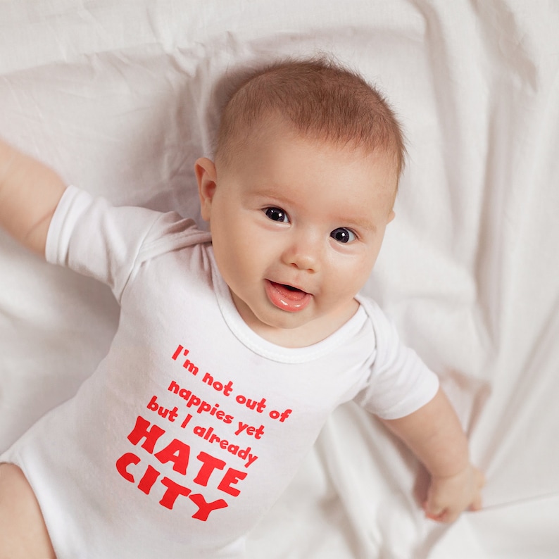 Manchester United Baby Gift. Hate City Baby Grow. Smiling Baby