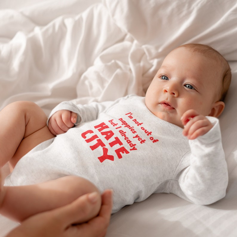 Manchester United Baby Gift. Hate City Baby Grow. Baby Lying Down.