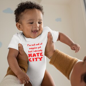 Manchester United Baby Gift. Hate City Baby Grow. Smiling Baby