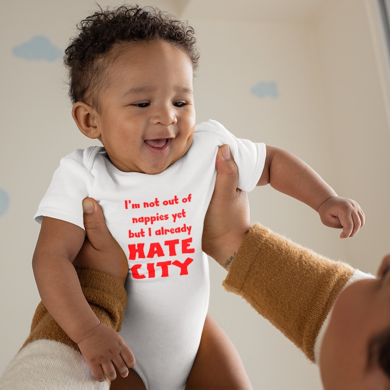 Manchester United Baby Gift. Hate City Baby Grow. Smiling Baby