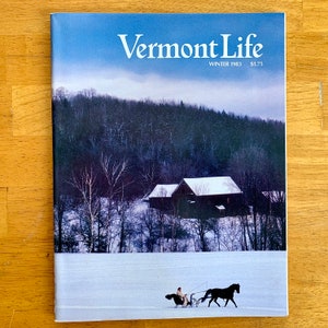 May include: A winter scene on the cover of Vermont Life magazine, Winter 1983. A horse-drawn sleigh travels through a snowy landscape with a farmhouse in the background.