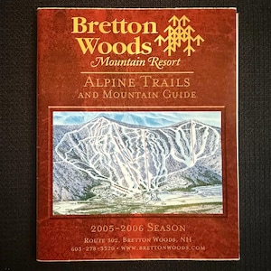May include: A brochure for Bretton Woods Mountain Resort. The cover is a deep red with gold text that reads "Bretton Woods Mountain Resort" and "Alpine Trails and Mountain Guide." The brochure features a map of the ski trails and the 2005-2006 season.