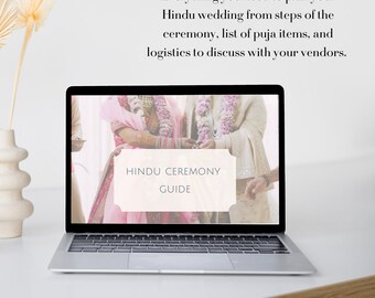 May include: A laptop computer screen displaying a guide for planning a Hindu wedding ceremony. The screen shows a couple in traditional Indian wedding attire, with the text "Hindu Ceremony Guide" in a white box.