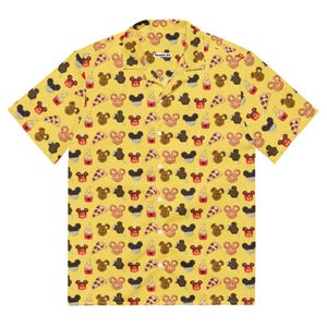 May include: Yellow short-sleeved shirt featuring a pattern of Mickey Mouse-themed food. The design includes pretzels, ice cream, pizza slices, and ice lollies. The shirt has a classic collar and the text "Fawsome Art" is visible on the collar.