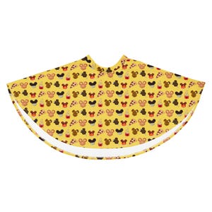 May include: Yellow skirt featuring a repeating pattern of Mickey Mouse heads, pizza slices, ice cream cones, and cupcakes. The skirt has a flared shape and a white lining.