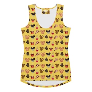 May include: A yellow vest top featuring a repeating pattern of cartoon food items, including ice cream, pizza, and Mickey Mouse-shaped treats. The top has a scoop neck and a fitted shape. The tag reads "Fantastic Art".
