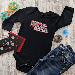Red/Black/Grey mini arrow print NE with &quot;Made in&quot; label, on Black Baby Bodysuit