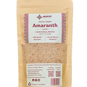 Puede incluir: Una bolsa de papel marrón de amaranto de grano entero. La bolsa tiene una ventana transparente que muestra los granos. La etiqueta dice "Mexican Amaranth" y "Whole Grain Amaranth". El peso neto es de 200g.