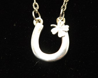 Luck Charm necklace, silver tone horse shoe with clover charm and a silver tone chain.