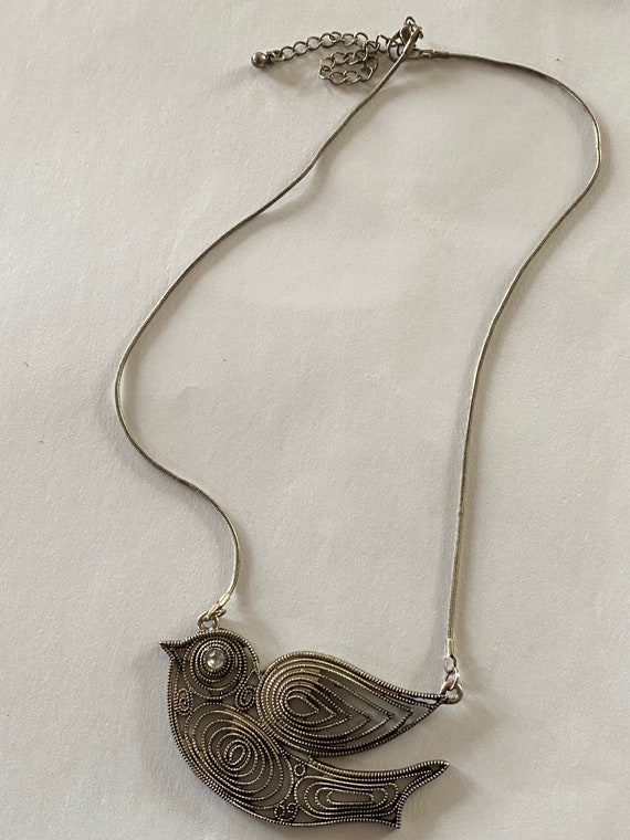 Beautiful vintage handcrafted silver metal bird ne