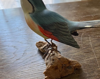 Vintage hand carved bird on wood