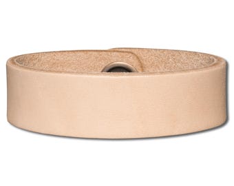 May include: A light brown leather strap with a metal button.
