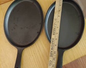 Vintage oval cast iron skillets pair of 2 new old stock black unbranded frying pans 9 quot long farm country cookware rustic farmhouse decor