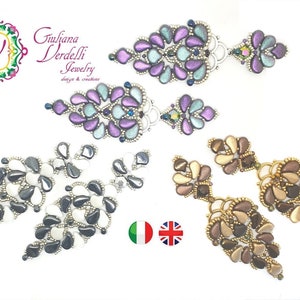 Op de afbeelding: Een assortiment handgemaakte oorbellen in diverse kleuren, waaronder paars, teal, zwart, wit en goud. De oorbellen hebben een uniek ontwerp met druppelvormige kralen. De tekst "Giuliana Verdelli Jewelry" is ook zichtbaar.