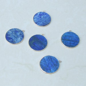 May include: Five round lapis lazuli pendants with gold trim. Each pendant has a different pattern of blue and white.