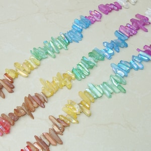 Rainbow AB Titanium Quartz Points Strand: Iridescent Crystal Beads (15-28mm)