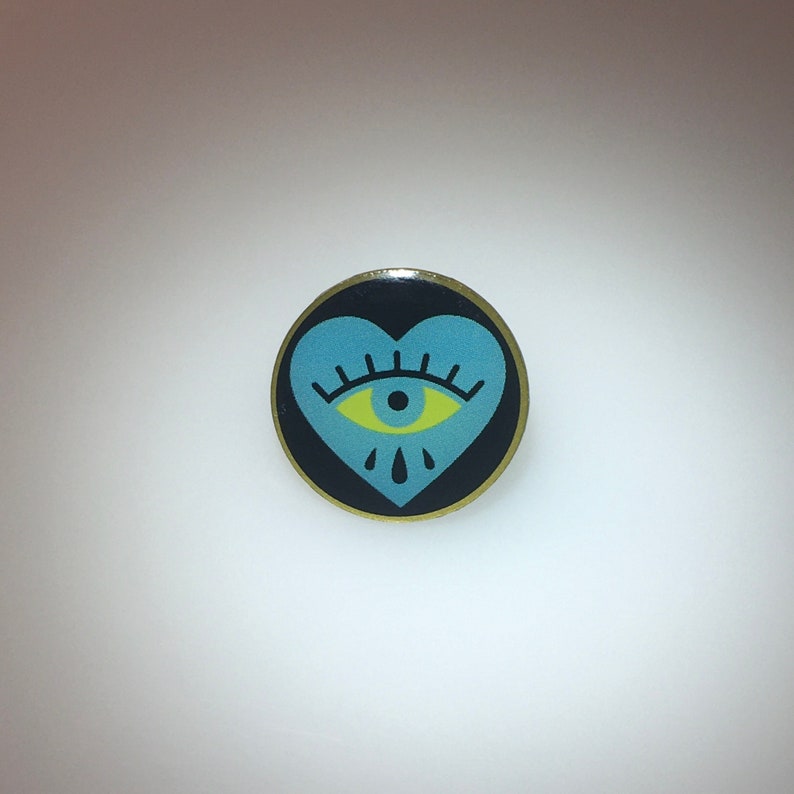 Teal crying heart eye pin image 1