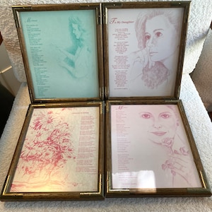 May include: Four framed art pieces with sketches and poems. The frames are wood-toned with brass corner accents. The art includes a portrait, a floral arrangement, and sketches of people. The poems are in black text.