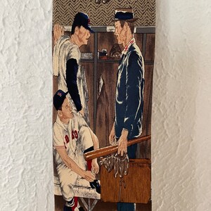 May include: A vintage tie featuring a colorful illustration of three baseball players in a locker room. The players are wearing baseball uniforms and holding bats. The tie is made of a woven fabric and has a brown background.