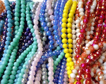 May include: Assortment of colorful glass beads in various shapes and sizes. The beads are strung together in strands and are perfect for jewelry making or crafting.