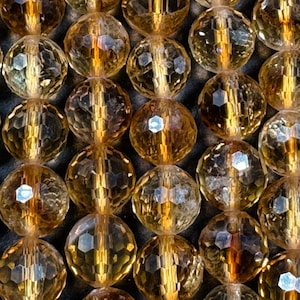 AAA Natural Faceted citrine gemstone round bead. excellent quality . gorgeous natural honey yellow color. not treated . full strand 15.5”