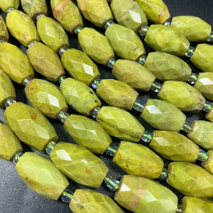 Natural olive opal gemstone bead. Faceted 12x16mm barrel shape. Gorgeous natural olive green color. Opal gemstone bead. Loose bead . 15.5”