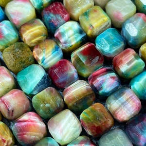 Beautiful rainbow galaxy tiger eye bead. Faceted 9mm cube shape. Beautiful rainbow galaxy color. High quality gemstone bead!