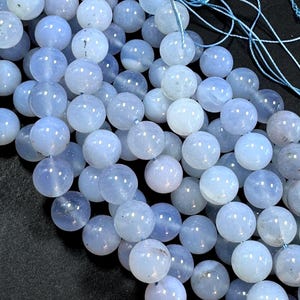 Natural chalcedony gemstone bead .  Smooth round bead. 4mm 6mm 8mm 10mm 12mm round bead . Excellent quality. Full strand 15.5”