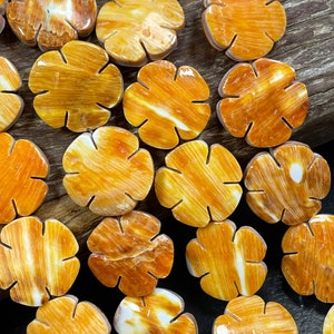 AAA Natural spiny oyster shell bead . Gorgeous natural yellow orange color. Beautiful unique flower shape . Excellent quality. Spiny oyster