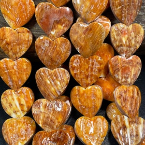 AAA Natural spiny oyster heart shape shell beads . Gorgeous natural orange yellow spiny oyster shell bead. Unique Shape excellent quality.