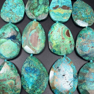 Beautiful new ocean jasper bead. Faceted 40x54mm teardrop Shape. Beautiful blue brown color. Unique looking gemstone bead! Great for pendant