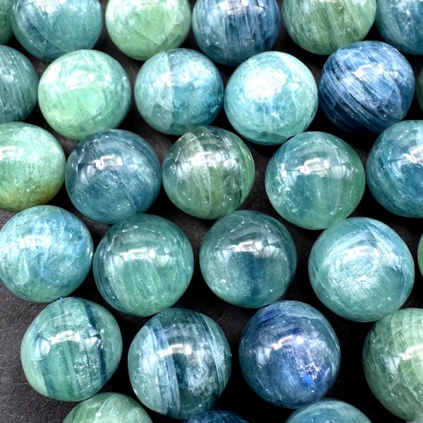 AAA Natural green kyanite gemstone bead. Smooth round bead. Gorgeous Natural green blue color . Excellent quality. Full strand 15.5”